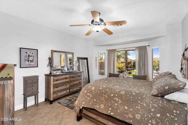 bedroom featuring tile patterned floors, access to outside, and baseboards