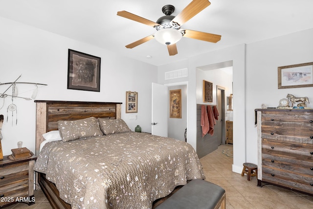 bedroom featuring light tile patterned flooring, visible vents, and ceiling fan