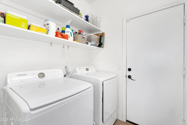 washroom with washer and clothes dryer and laundry area