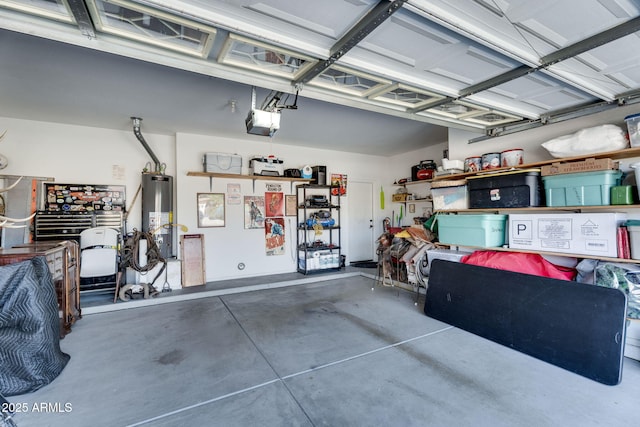 garage featuring a garage door opener and water heater