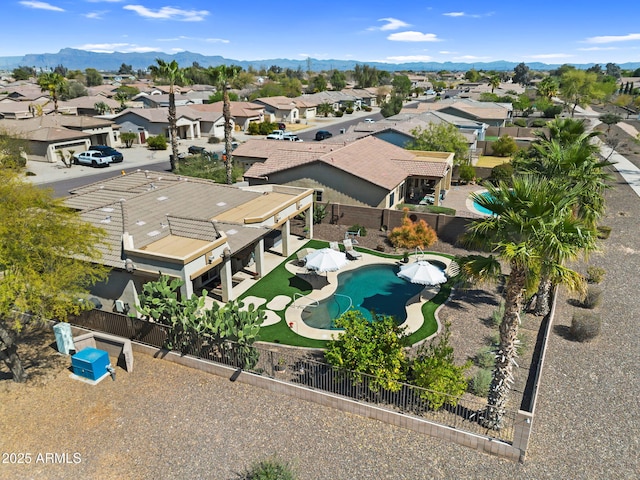 drone / aerial view featuring a mountain view and a residential view