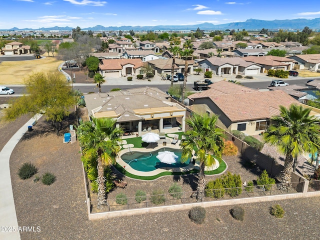 birds eye view of property with a mountain view and a residential view