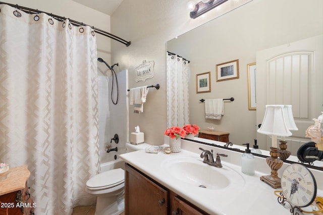 bathroom with shower / tub combo with curtain, vanity, and toilet