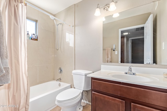 full bathroom featuring shower / bath combination with curtain, vanity, and toilet