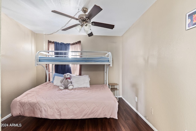 bedroom with ceiling fan and hardwood / wood-style floors