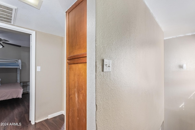 hallway featuring dark hardwood / wood-style flooring