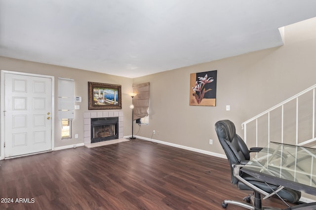 office area featuring a fireplace and dark hardwood / wood-style floors