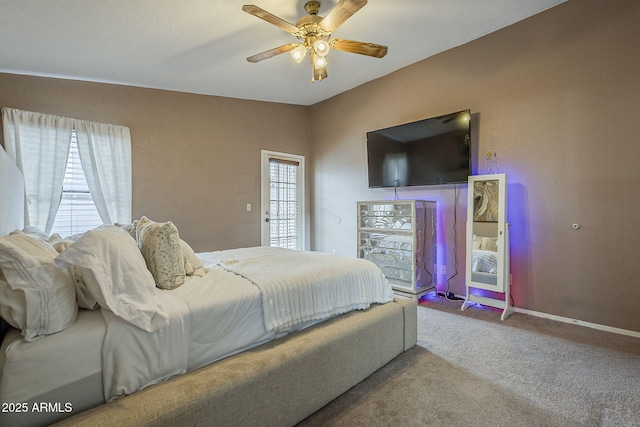 carpeted bedroom featuring ceiling fan and baseboards