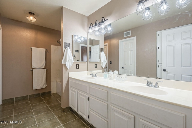 bathroom featuring shower / bathtub combination, double vanity, tile patterned flooring, and a sink