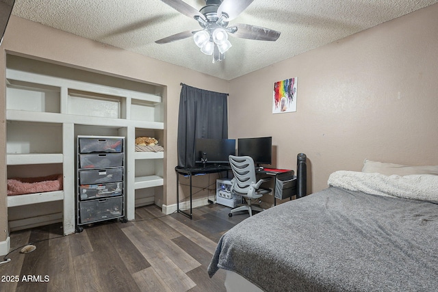 bedroom featuring baseboards, a textured ceiling, a ceiling fan, and wood finished floors