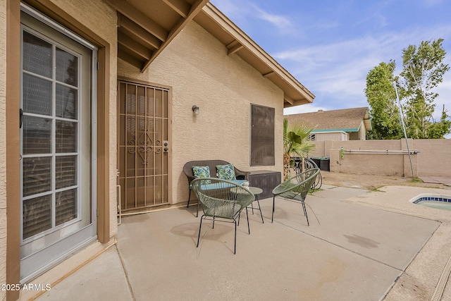 view of patio / terrace with fence