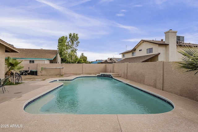 view of swimming pool featuring a fenced in pool, a fenced backyard, and a patio