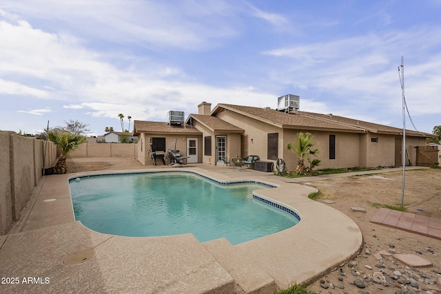 view of swimming pool with a fenced in pool, a patio area, a fenced backyard, and central air condition unit