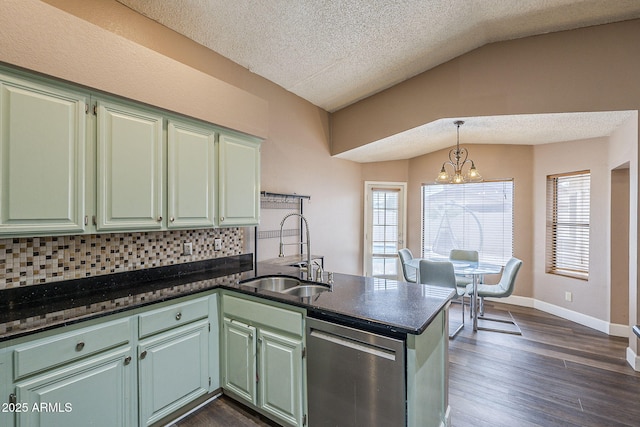 kitchen featuring lofted ceiling, a peninsula, dark wood-style flooring, a sink, and dishwasher