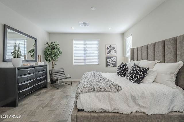 bedroom with hardwood / wood-style floors