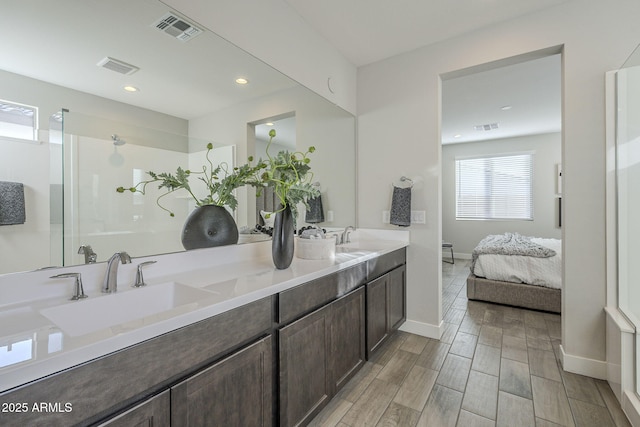 bathroom with vanity and walk in shower