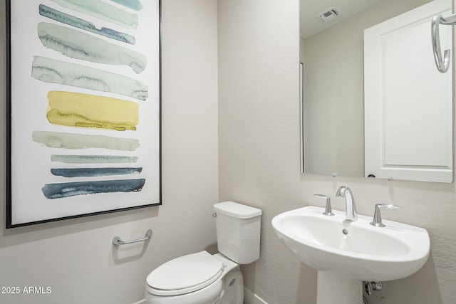 bathroom featuring sink and toilet