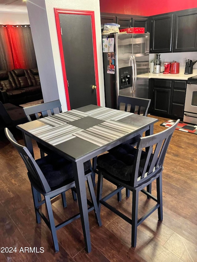 dining space featuring hardwood / wood-style flooring