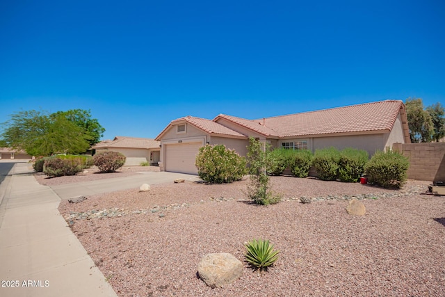 11352 E Dartmouth St, Mesa, AZ 85207 - view of front of home with a tile roof, stucco siding, concrete driveway, and a garage