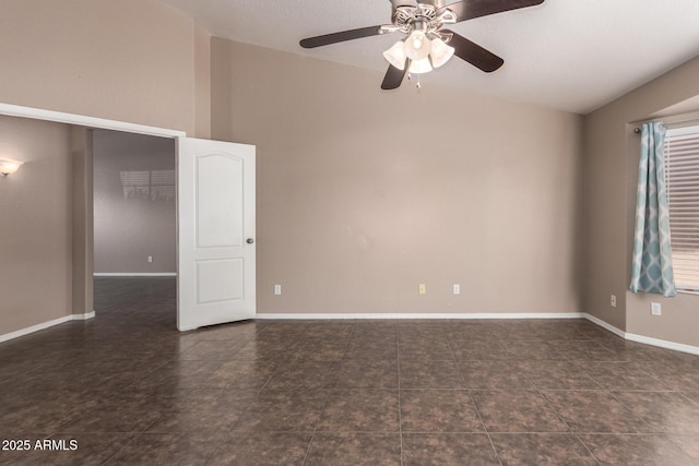11352 E Dartmouth St, Mesa, AZ 85207 - empty room with a ceiling fan, lofted ceiling, and tile patterned flooring
