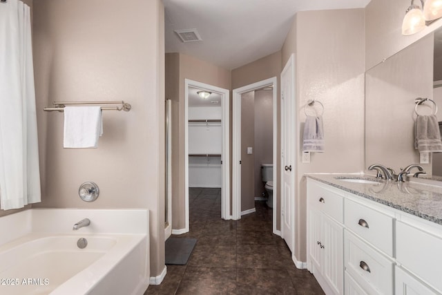 11352 E Dartmouth St, Mesa, AZ 85207 - bathroom with a garden tub, vanity, and tile patterned floors