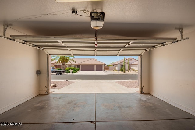 11352 E Dartmouth St, Mesa, AZ 85207 - garage with a garage door opener and baseboards