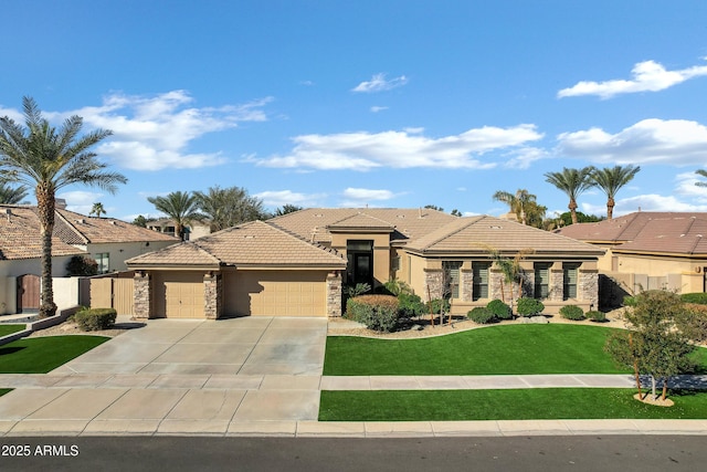 view of front of house with a garage and a front yard