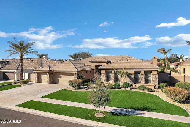 view of front of home featuring a garage and a front yard