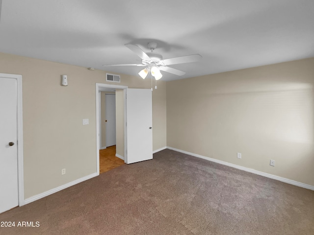 unfurnished bedroom featuring ceiling fan and carpet floors