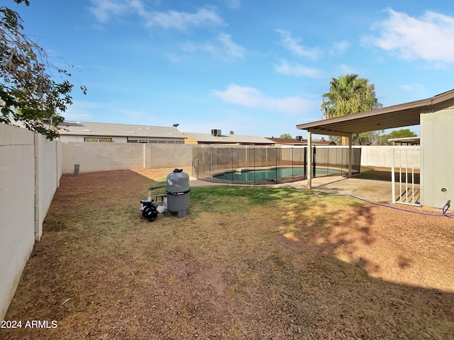 view of yard with a fenced in pool