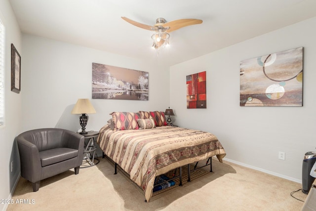 bedroom featuring baseboards, carpet floors, and a ceiling fan