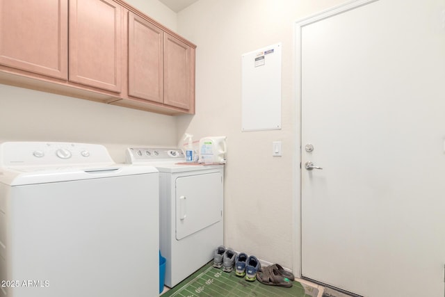 clothes washing area with cabinet space and washing machine and clothes dryer