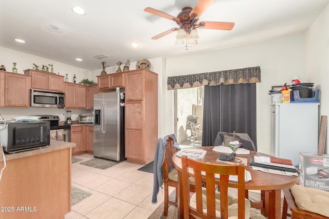 kitchen featuring light tile patterned floors, appliances with stainless steel finishes, ceiling fan, and recessed lighting