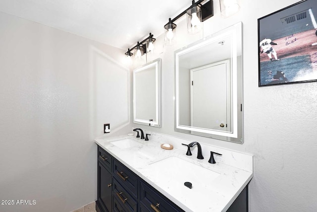 bathroom featuring double vanity and a sink