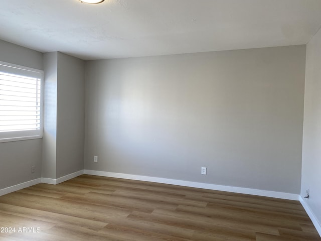 unfurnished room featuring light hardwood / wood-style flooring