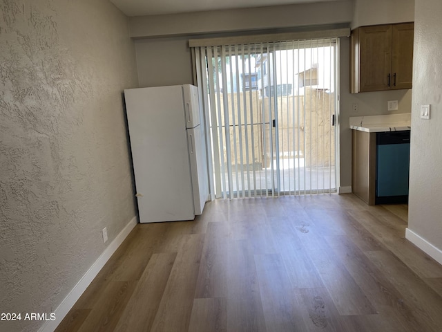 empty room with light hardwood / wood-style floors