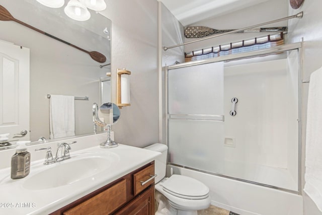 full bath with toilet, enclosed tub / shower combo, and vanity