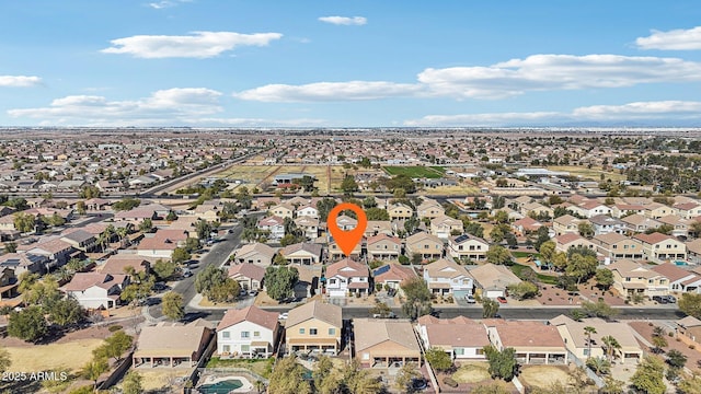 birds eye view of property with a residential view