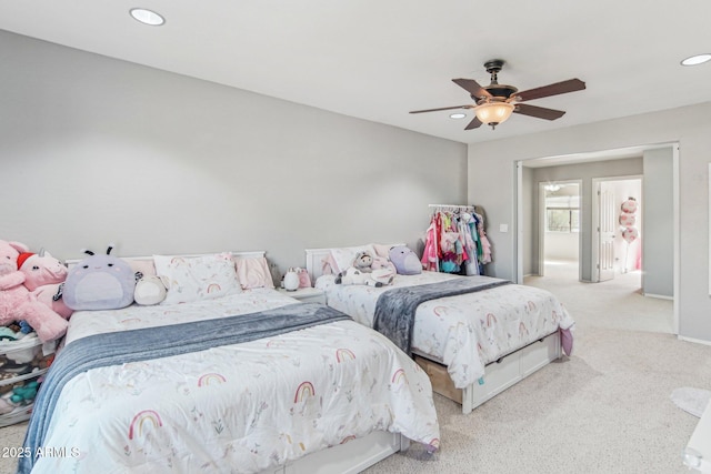 carpeted bedroom with ceiling fan and recessed lighting