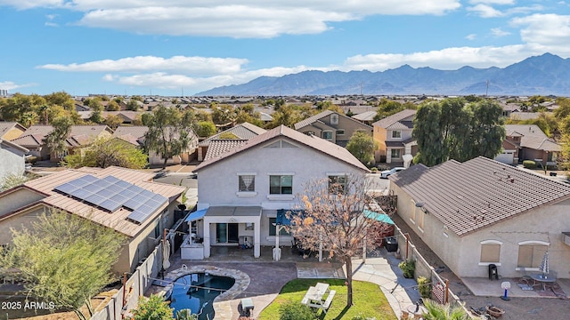 drone / aerial view featuring a residential view and a mountain view