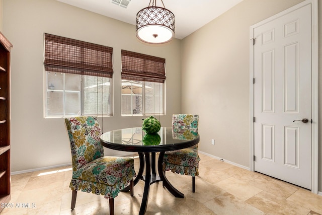 2554 E Honeysuckle Pl, Chandler, AZ 85286 - dining room featuring baseboards and light tile patterned floors