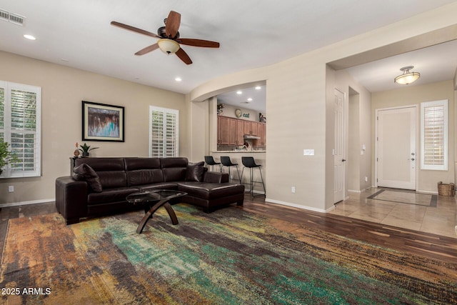 2554 E Honeysuckle Pl, Chandler, AZ 85286 - living area featuring a ceiling fan, recessed lighting, wood finished floors, and arched walkways