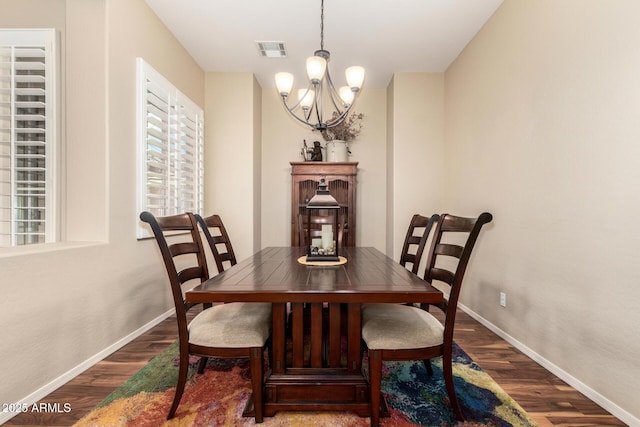 2554 E Honeysuckle Pl, Chandler, AZ 85286 - dining room featuring a chandelier and dark wood-style floors