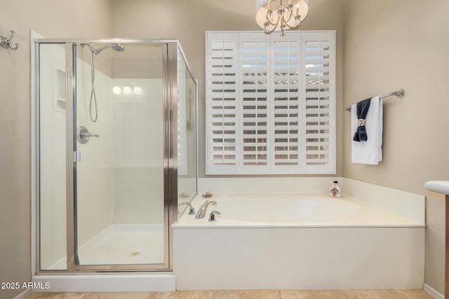 2554 E Honeysuckle Pl, Chandler, AZ 85286 - bathroom with a shower stall, a garden tub, and a chandelier