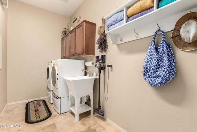 2554 E Honeysuckle Pl, Chandler, AZ 85286 - laundry room with washing machine and clothes dryer and cabinet space