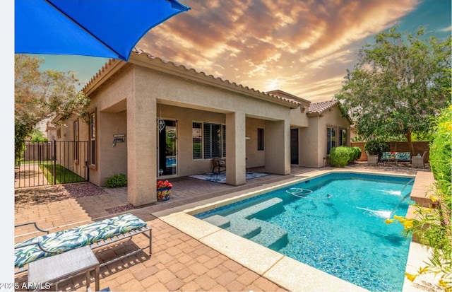 2554 E Honeysuckle Pl, Chandler, AZ 85286 - pool at dusk with a patio