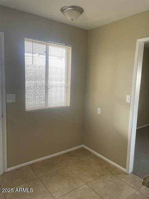 empty room with light tile patterned floors