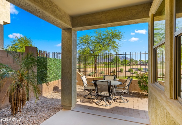 view of patio / terrace with outdoor dining space and a fenced backyard
