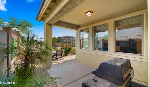 view of patio / terrace featuring grilling area and fence
