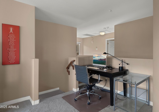carpeted office space featuring baseboards